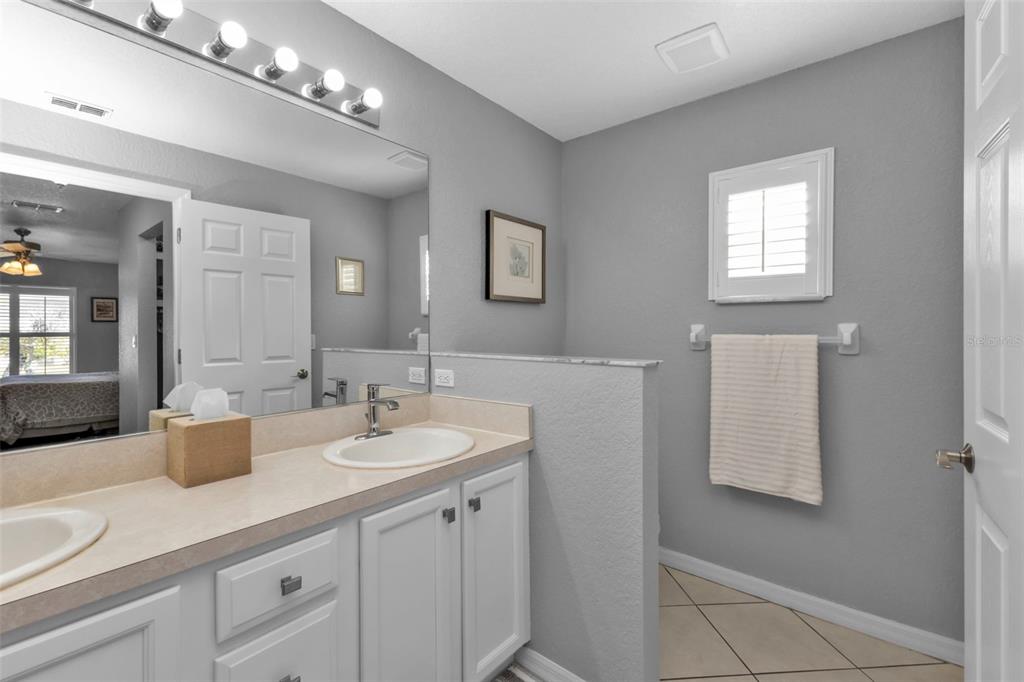 24415 Buckingham Way Punta Gorda, FL 33980 - Photo 15 of 41 a bathroom with a sink and a mirror
