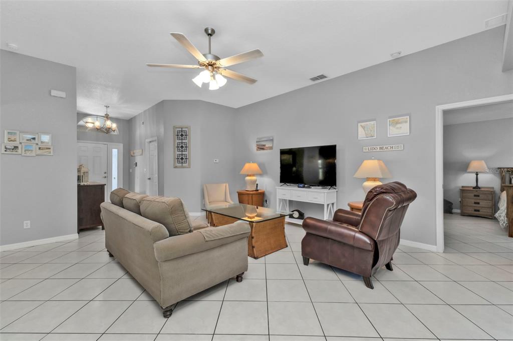 24415 Buckingham Way Punta Gorda, FL 33980 - Photo 4 of 41 a living room with furniture and a flat screen tv