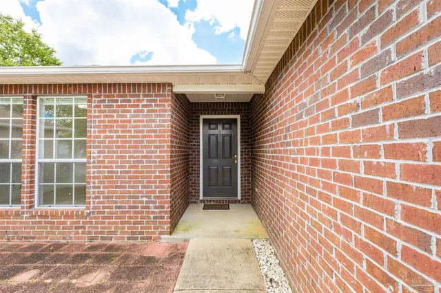 a view of a brick house with a window