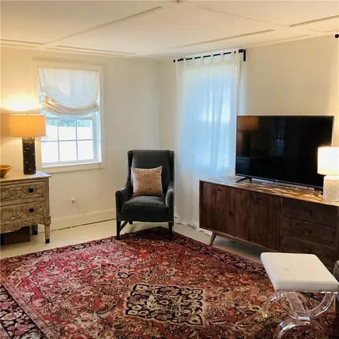 a living room with a couch and a flat screen tv