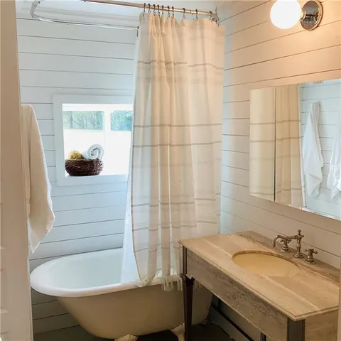 a bathroom with a sink and toilet