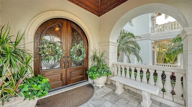 a living room with fireplace furniture and a view of kitchen