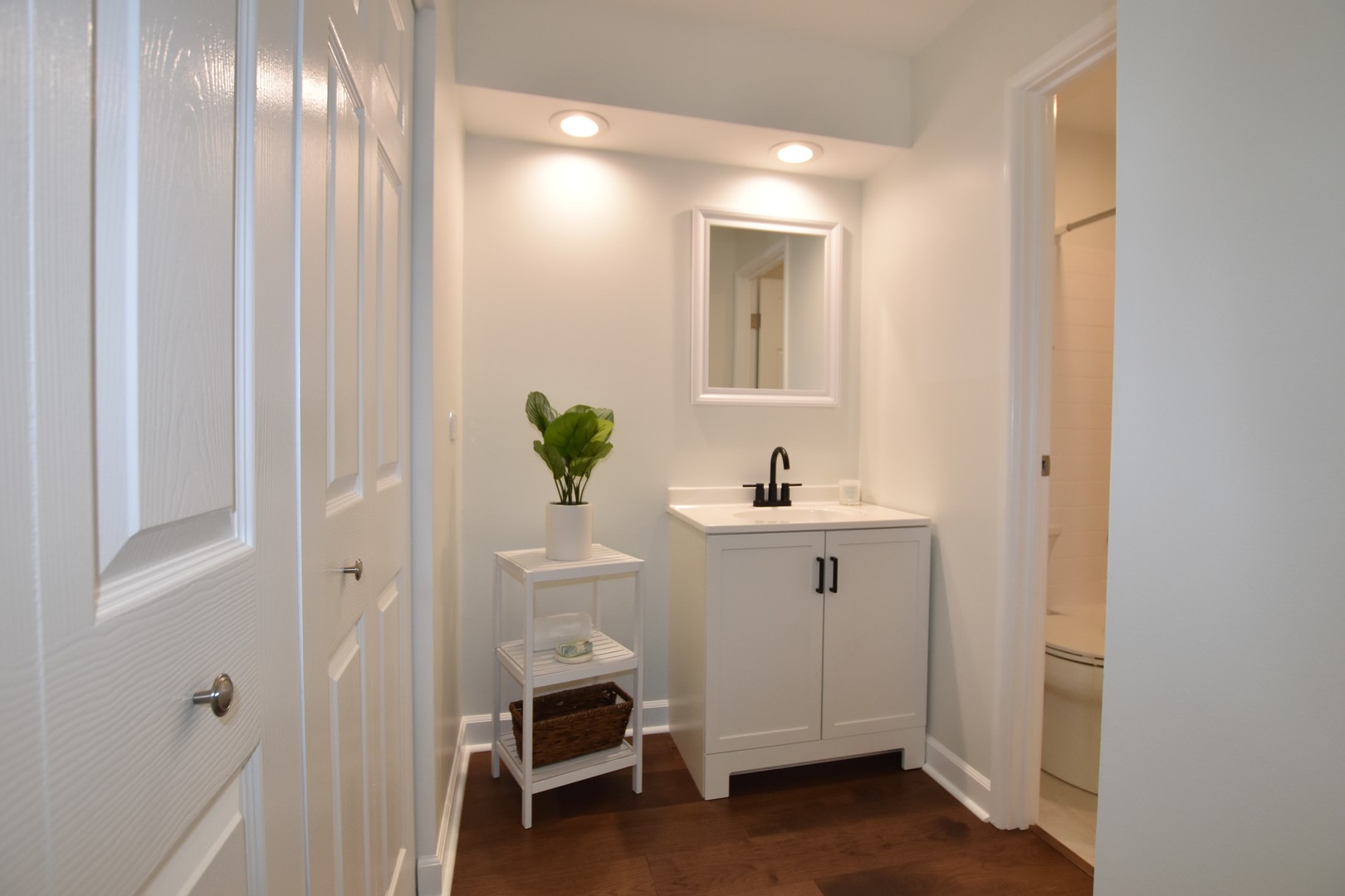 500 West Huntington Commons Road, Unit 157 Mount Prospect, IL 60056 - Photo 16 of 24 a bathroom with a sink and a mirror