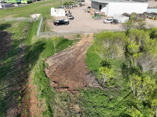a view of backyard with outdoor seating and green space