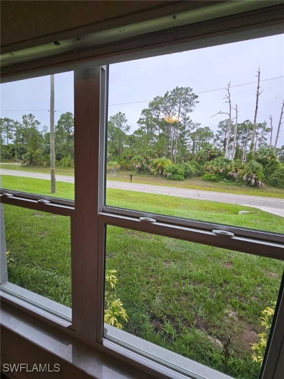 1506 Rugby Circle LaBelle, FL 33935 - Photo 12 of 13 a view of a back yard from a window
