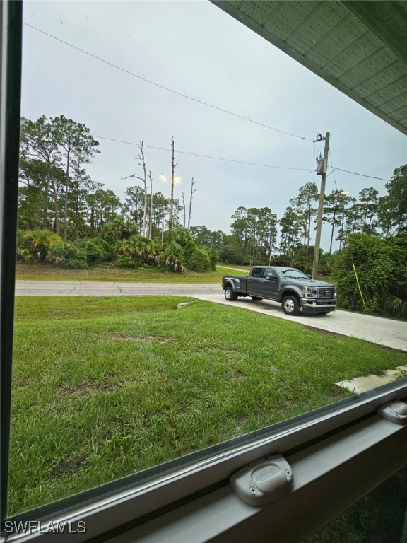 1506 Rugby Circle LaBelle, FL 33935 - Photo 13 of 13 a view of a yard with an outdoor space