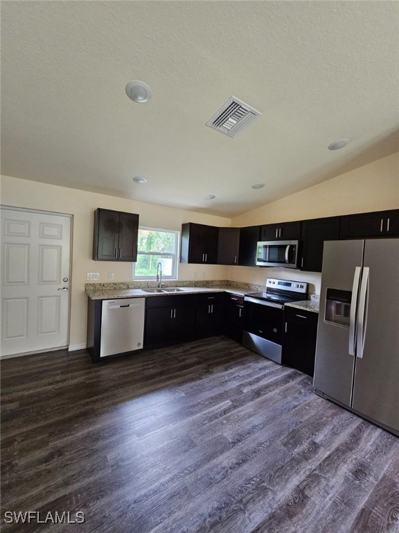 1506 Rugby Circle LaBelle, FL 33935 - Photo 2 of 13 a large kitchen with cabinets and stainless steel appliances