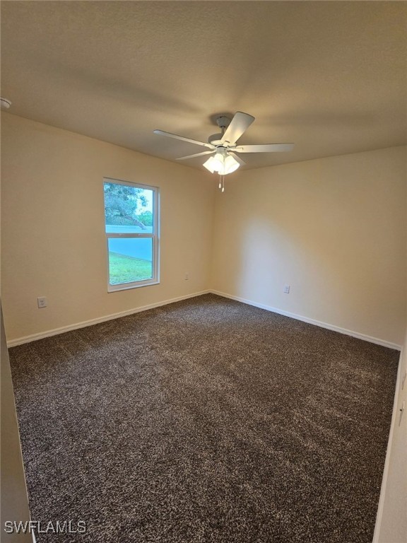 1506 Rugby Circle LaBelle, FL 33935 - Photo 6 of 13 an empty room with windows and fan