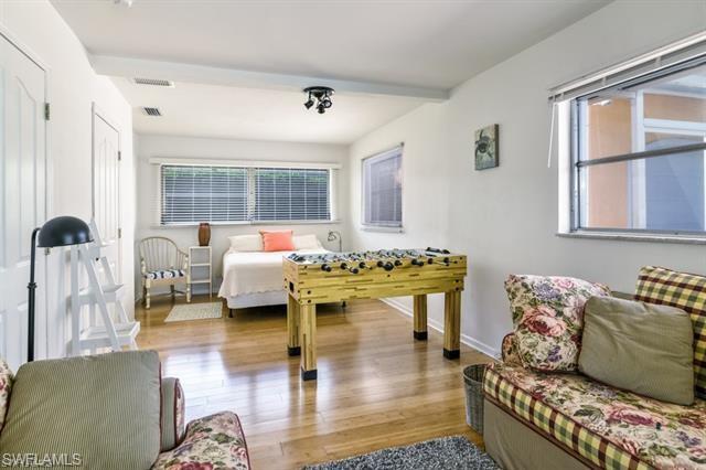 737 Mooring Line Drive Naples, FL 34102 - Photo 16 of 24 a living room with furniture and a large window