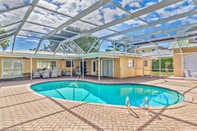 737 Mooring Line Drive Naples, FL 34102 - Photo 3 of 24 a view of swimming pool with seating space
