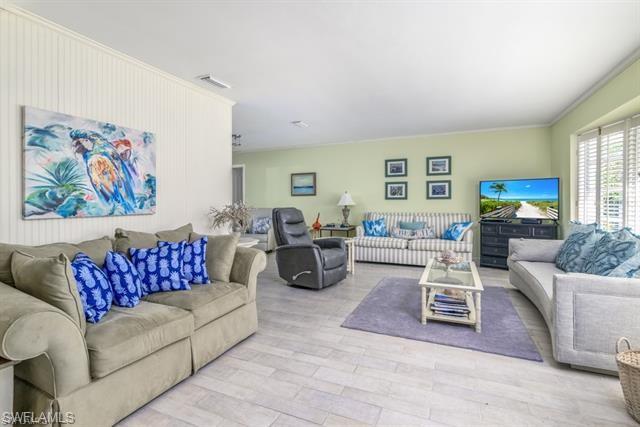 737 Mooring Line Drive Naples, FL 34102 - Photo 4 of 24 a living room with furniture or couch and a window