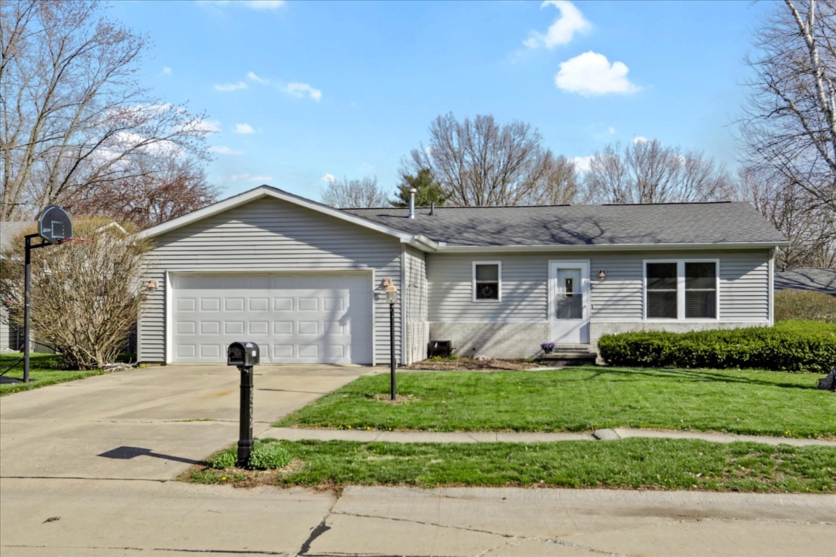 2302 Branch Road Champaign, IL 61821 - Photo 1 of 19 a front view of a house with a yard and garage