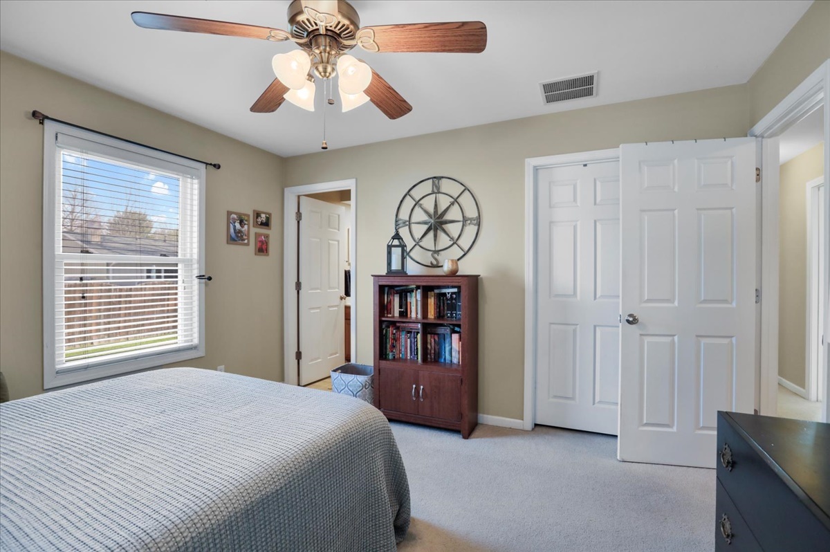 2302 Branch Road Champaign, IL 61821 - Photo 11 of 19 a bedroom with a large bed and a chandelier
