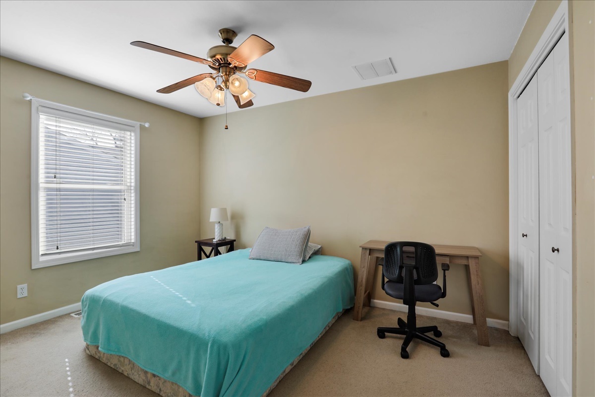 2302 Branch Road Champaign, IL 61821 - Photo 15 of 19 a bedroom with a bed and a chandelier