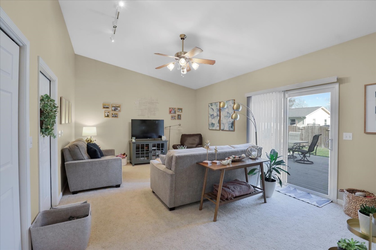 2302 Branch Road Champaign, IL 61821 - Photo 3 of 19 a living room with furniture and a flat screen tv