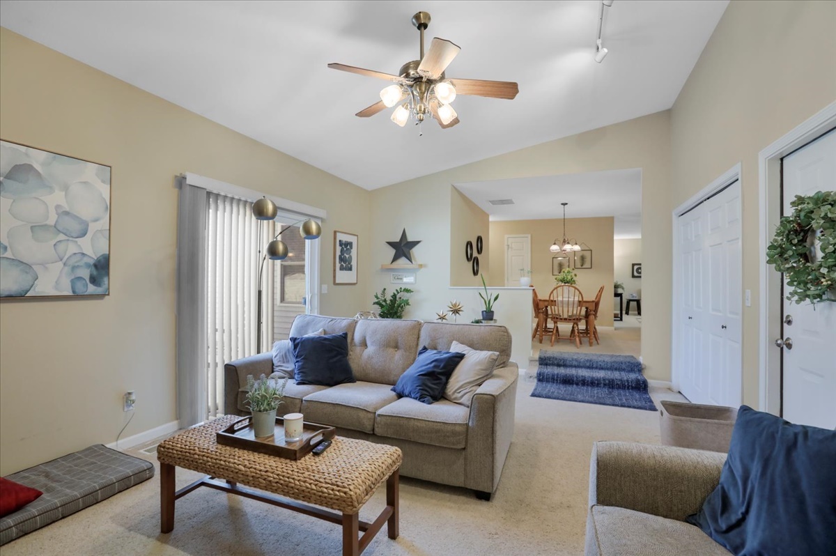 2302 Branch Road Champaign, IL 61821 - Photo 4 of 19 a living room with furniture and a chandelier