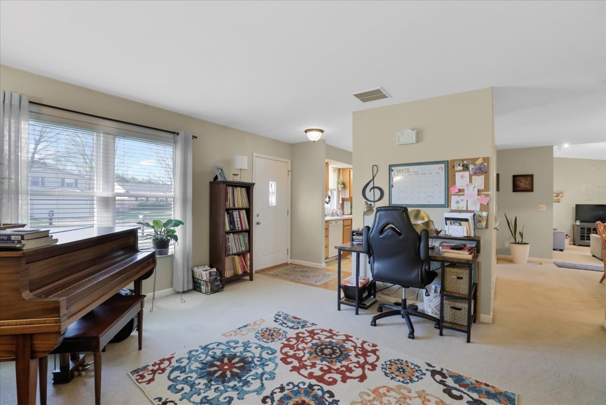 2302 Branch Road Champaign, IL 61821 - Photo 7 of 19 a view of a workspace with furniture and a window