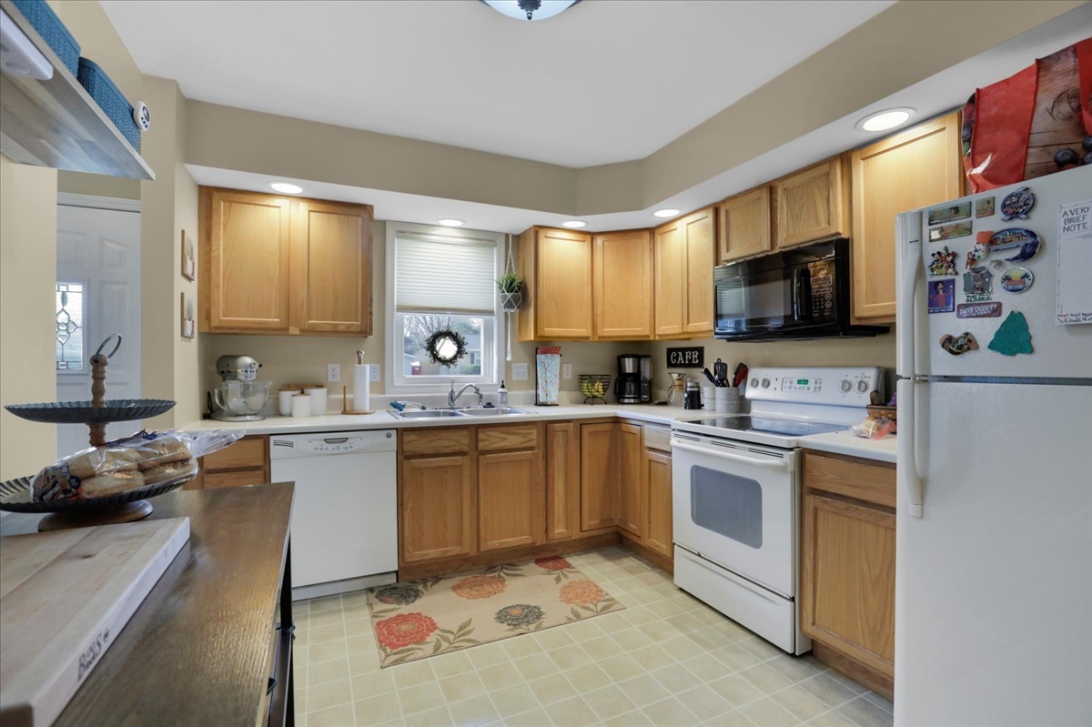 2302 Branch Road Champaign, IL 61821 - Photo 8 of 19 a kitchen with a sink stove top oven and microwave