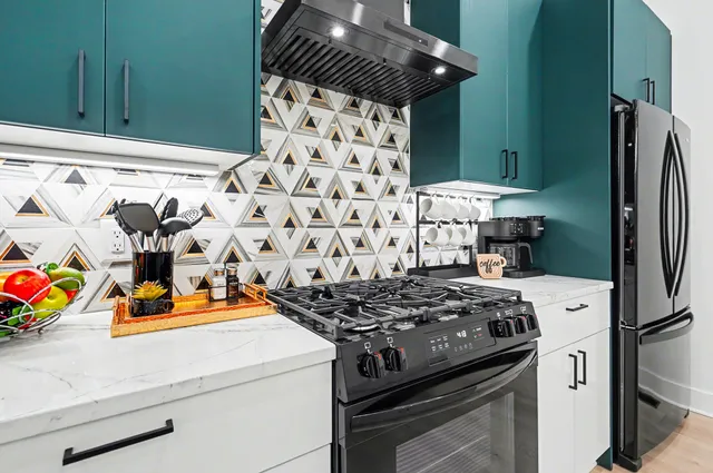 a kitchen with a stove and a refrigerator