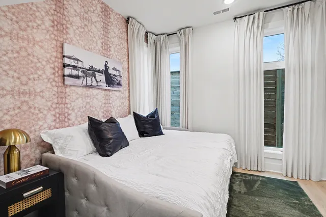 a bedroom with a bed and a table