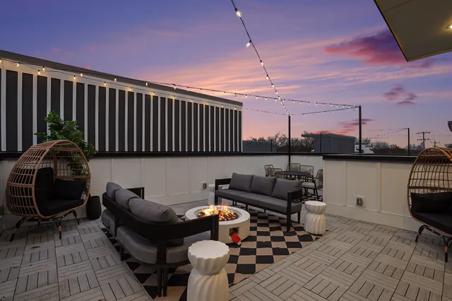 a view of a chairs and table in patio