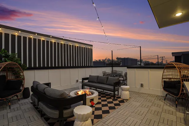 a reading room with furniture and a rug