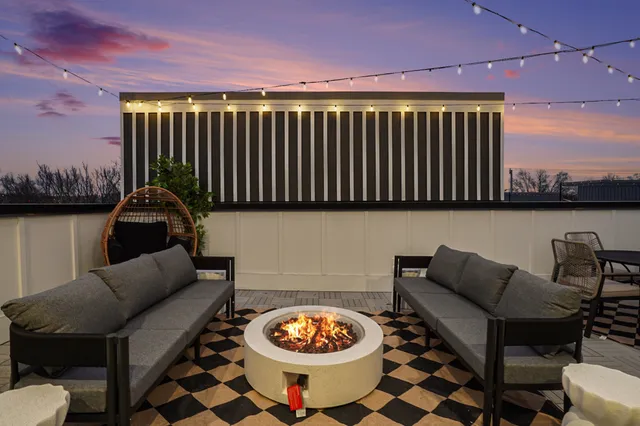 a view of a chair and table on the deck