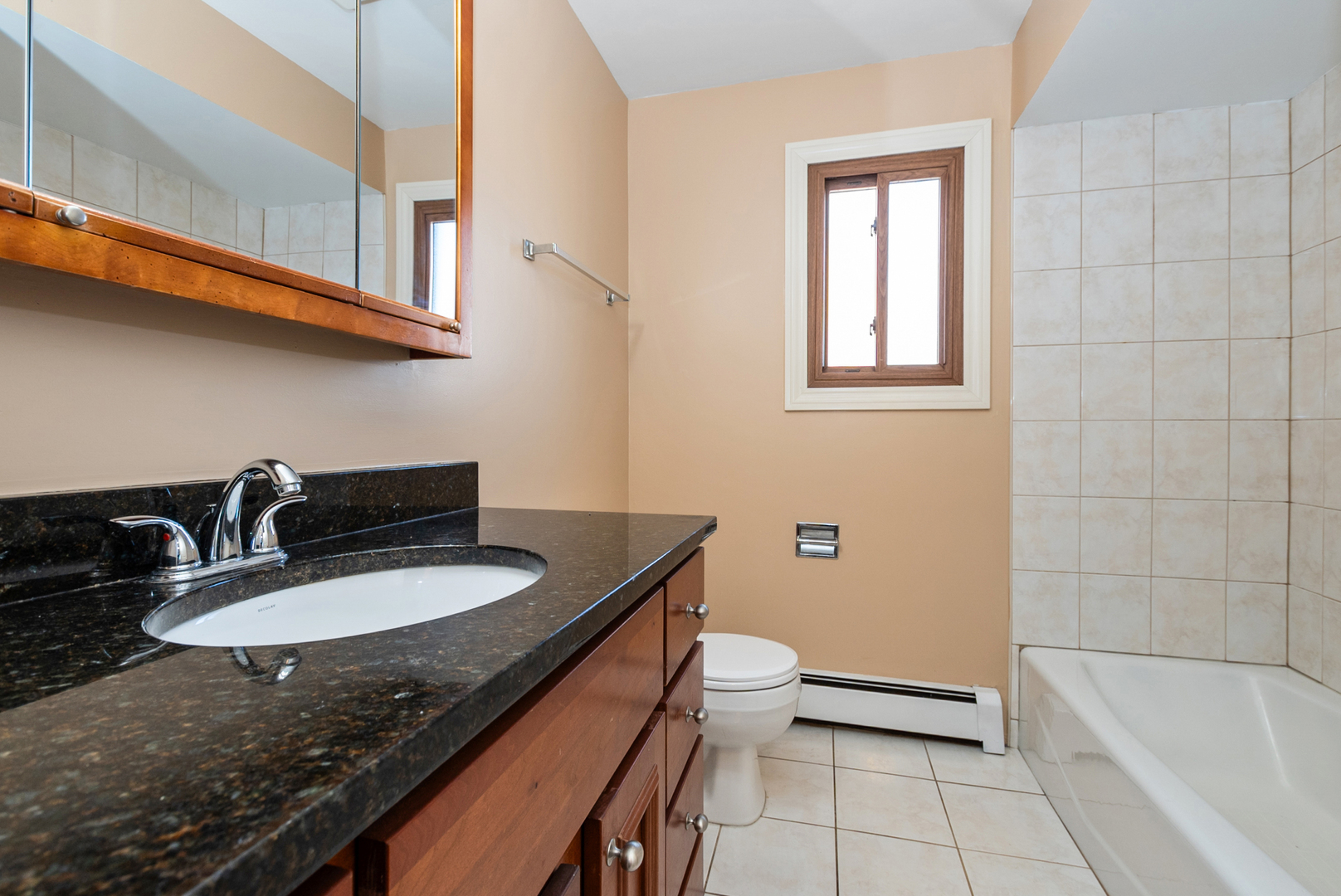10625 Parkside Avenue, Unit 8 Chicago Ridge, IL 60415 - Photo 11 of 16 a bathroom with a granite countertop sink a toilet and bathtub