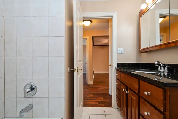 a kitchen with granite countertop a sink and cabinets