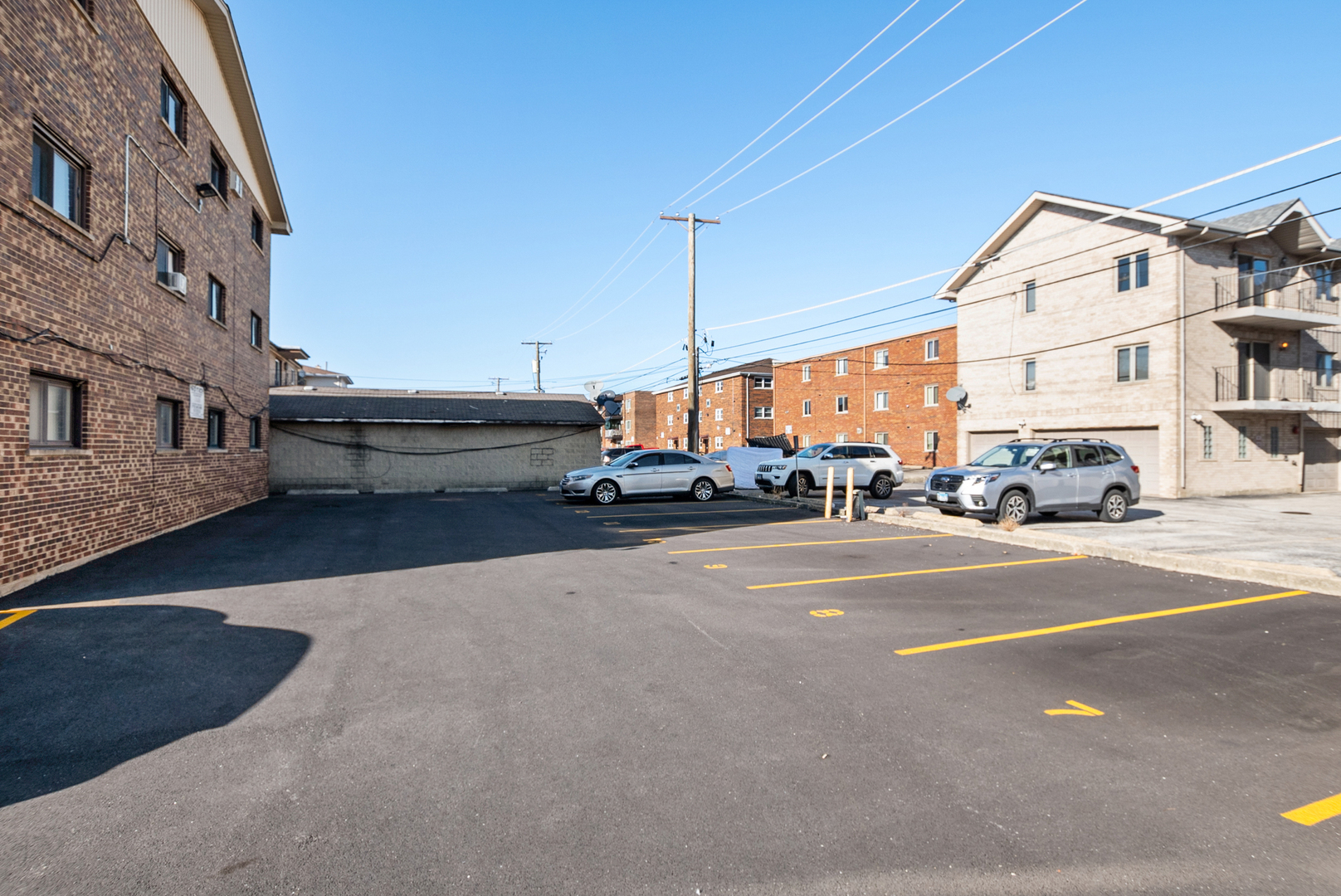 10625 Parkside Avenue, Unit 8 Chicago Ridge, IL 60415 - Photo 15 of 16 a car parked on the side of a street