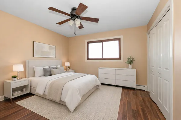 a bedroom with a bed and a window