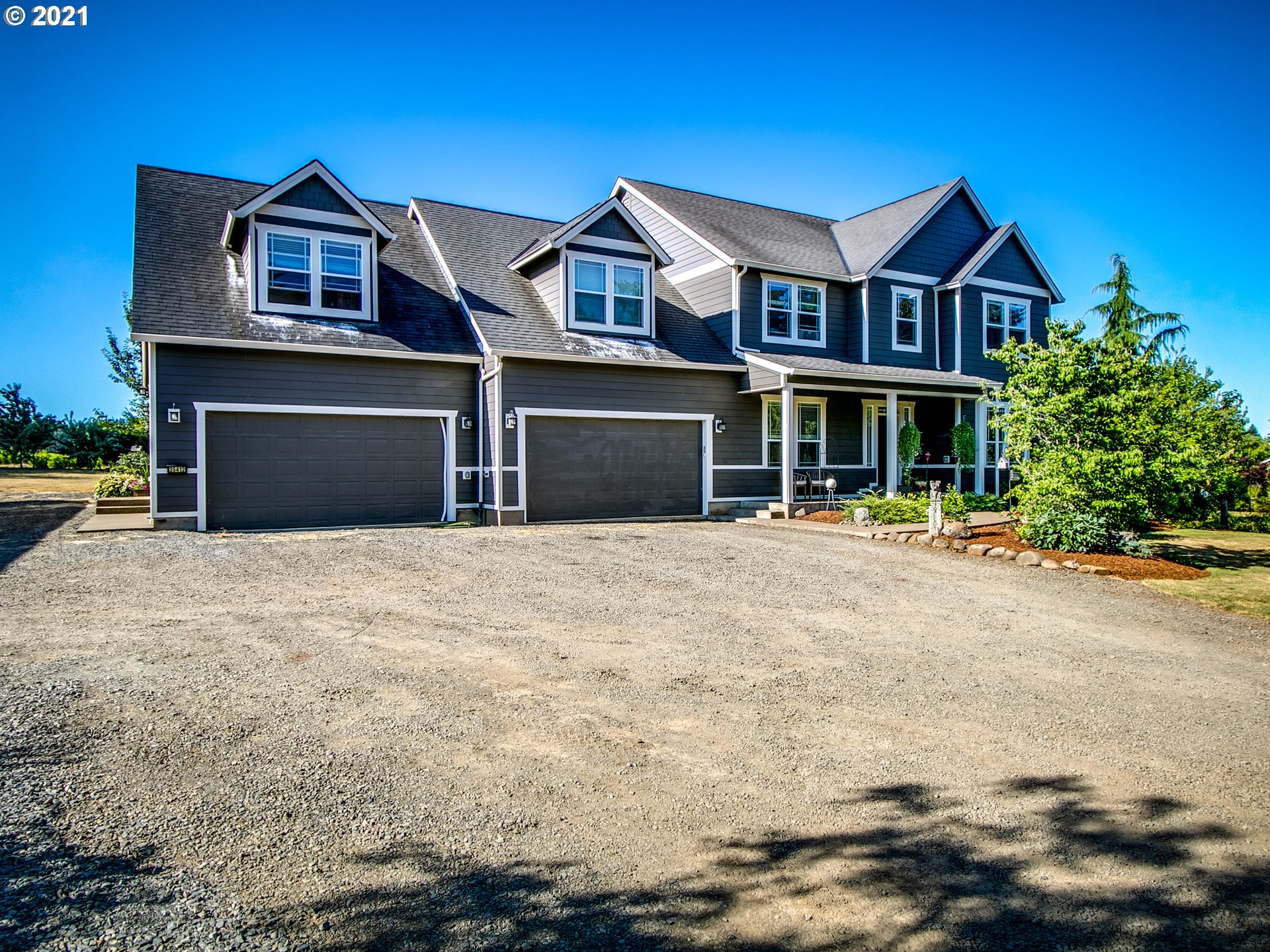 35412 Southeast Shade Tree Lane Estacada, OR 97023 - Photo 1 of 32 a front view of a house with a yard