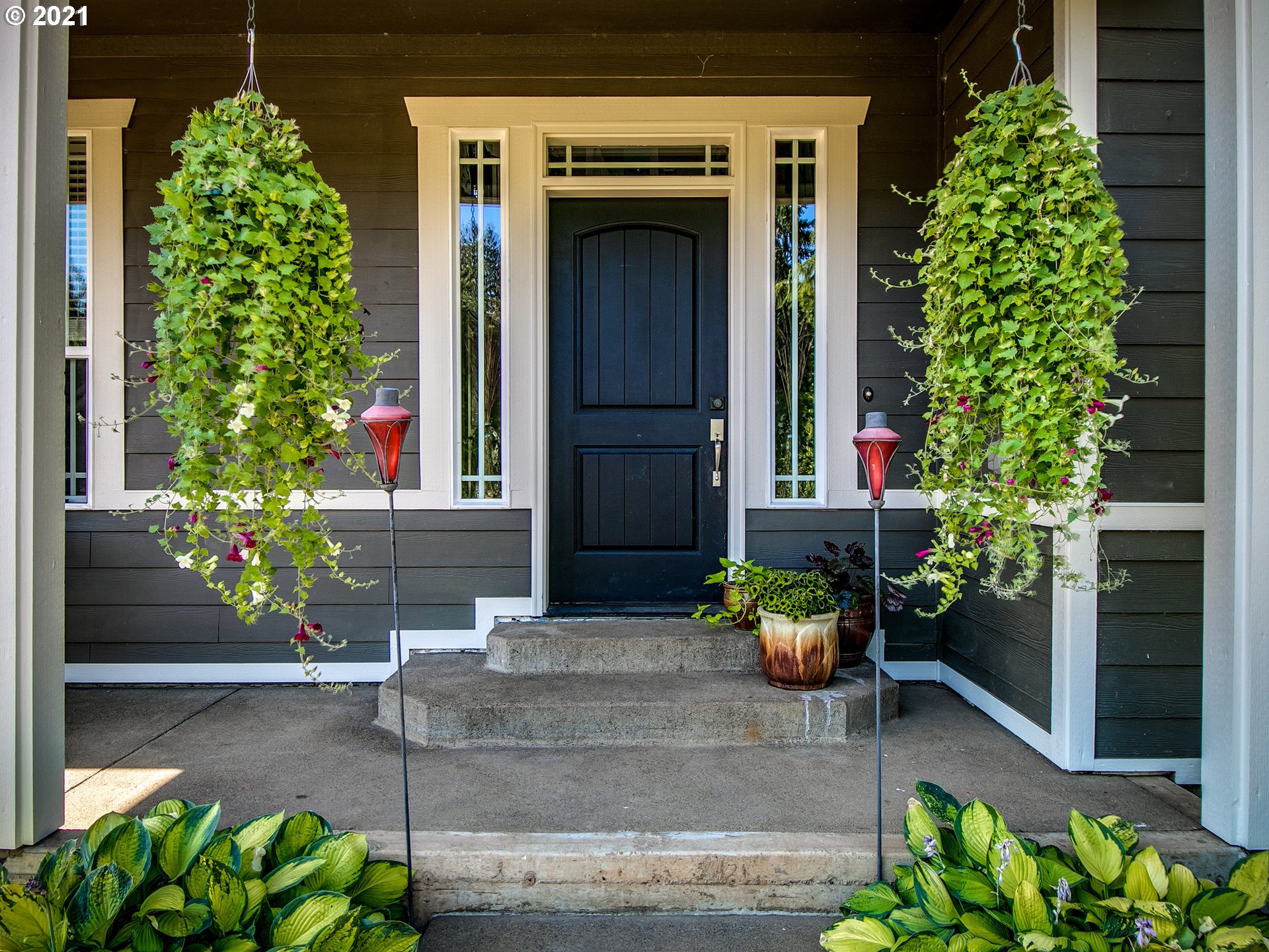 35412 Southeast Shade Tree Lane Estacada, OR 97023 - Photo 2 of 32 a front view of a house with an outdoor space and a garden