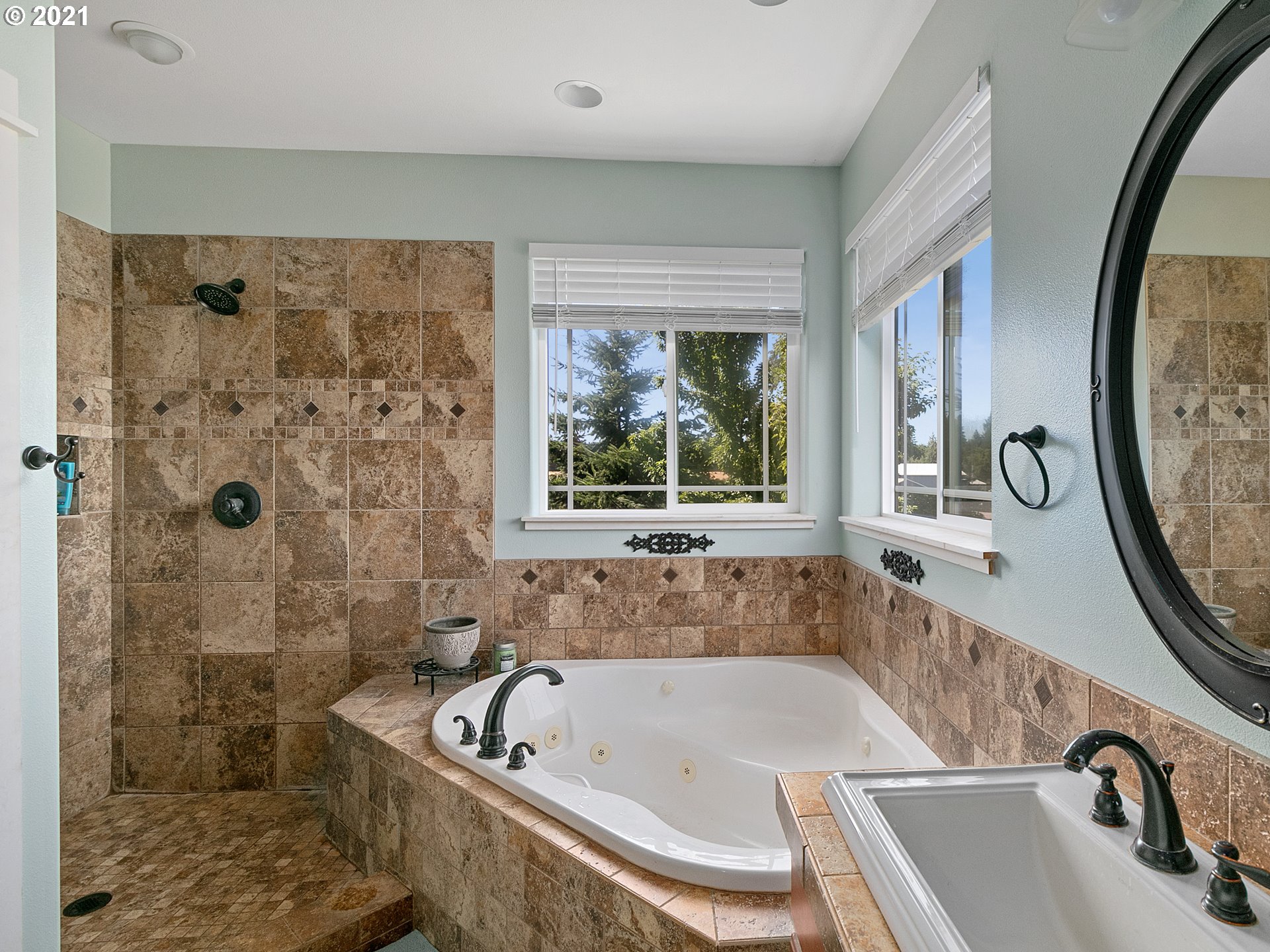 35412 Southeast Shade Tree Lane Estacada, OR 97023 - Photo 18 of 32 a bath tub sitting in a bathroom next to a window
