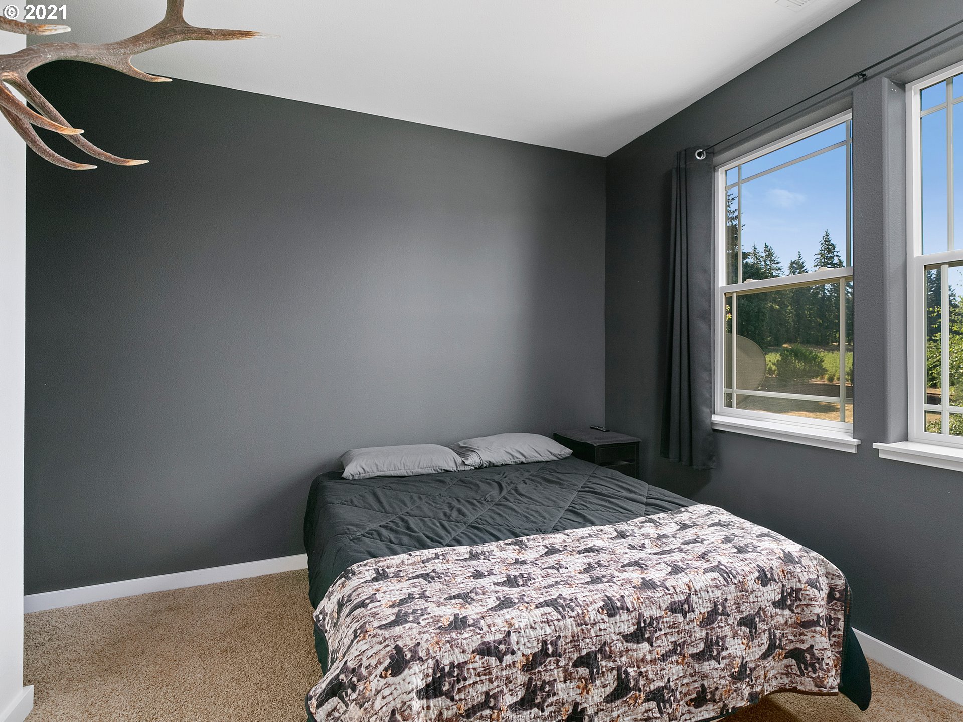 35412 Southeast Shade Tree Lane Estacada, OR 97023 - Photo 20 of 32 a bedroom with a bed and a window