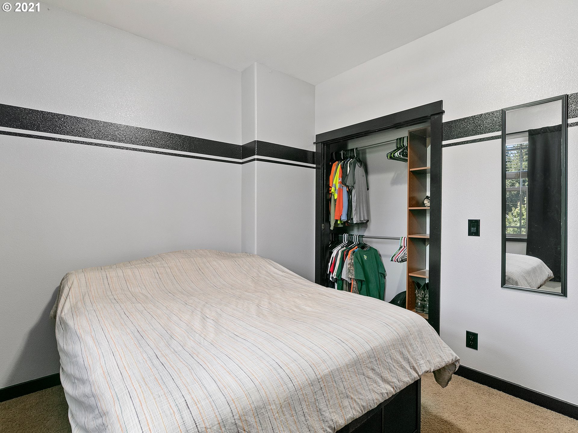 35412 Southeast Shade Tree Lane Estacada, OR 97023 - Photo 21 of 32 a bedroom with a bed and a mirror