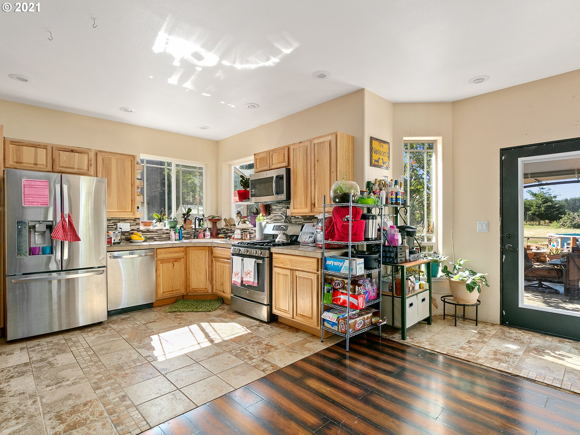 35412 Southeast Shade Tree Lane Estacada, OR 97023 - Photo 31 of 32 a kitchen that has a lot of cabinets and refrigerator