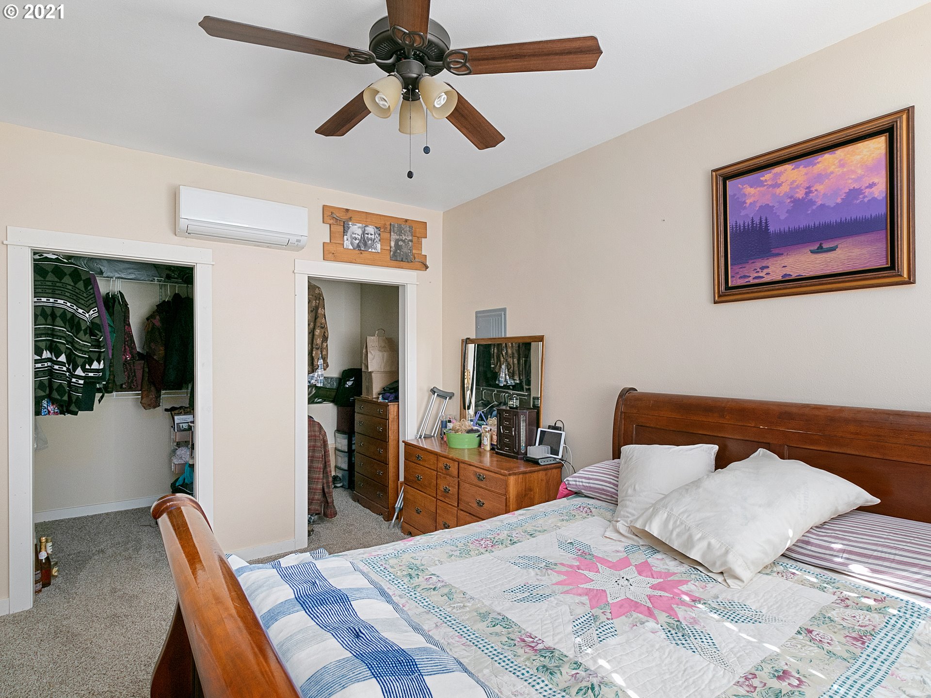 35412 Southeast Shade Tree Lane Estacada, OR 97023 - Photo 32 of 32 a bedroom with a bed and a chandelier