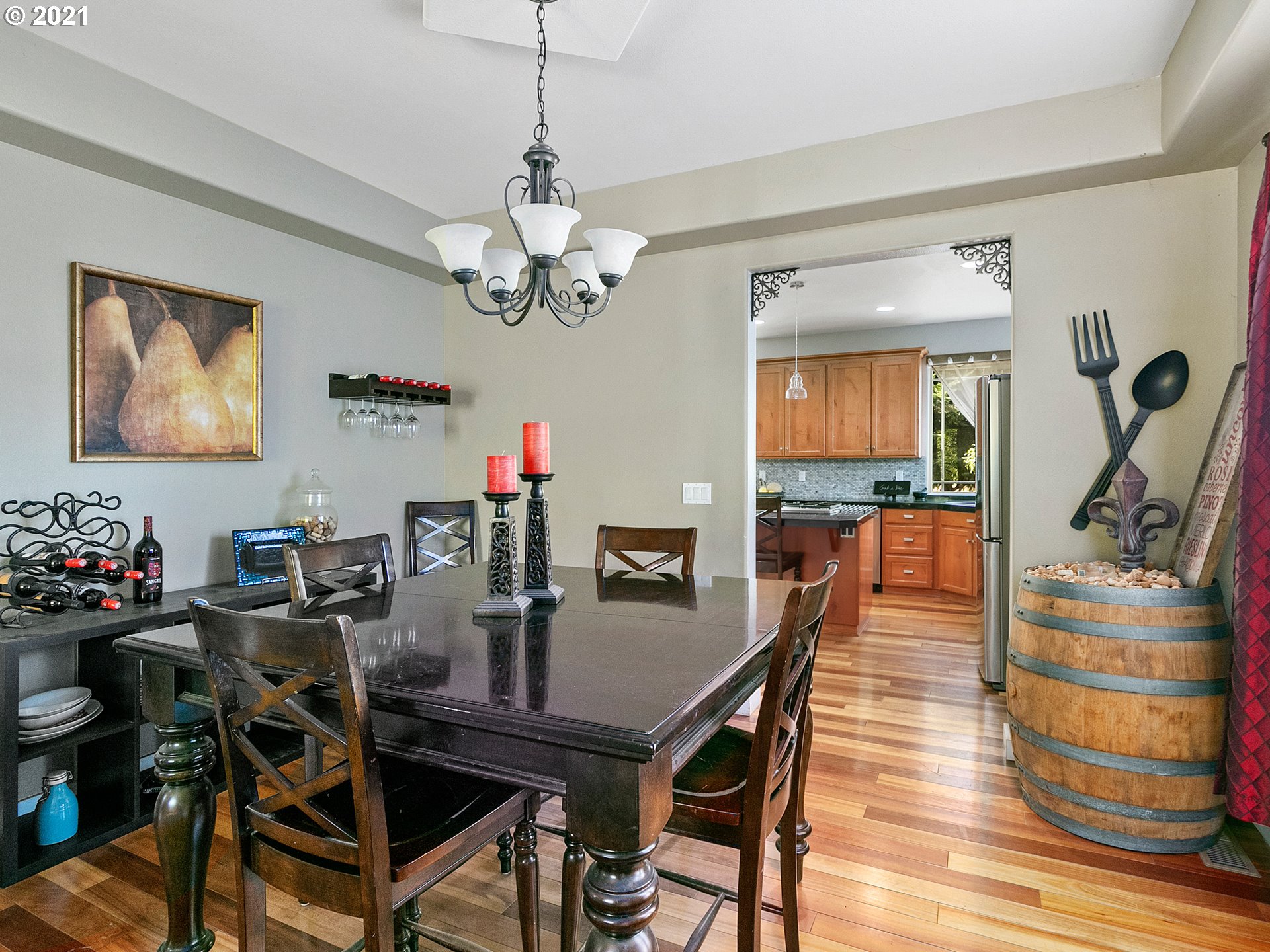35412 Southeast Shade Tree Lane Estacada, OR 97023 - Photo 6 of 32 a view of a dining room with furniture a chandelier and wooden floor