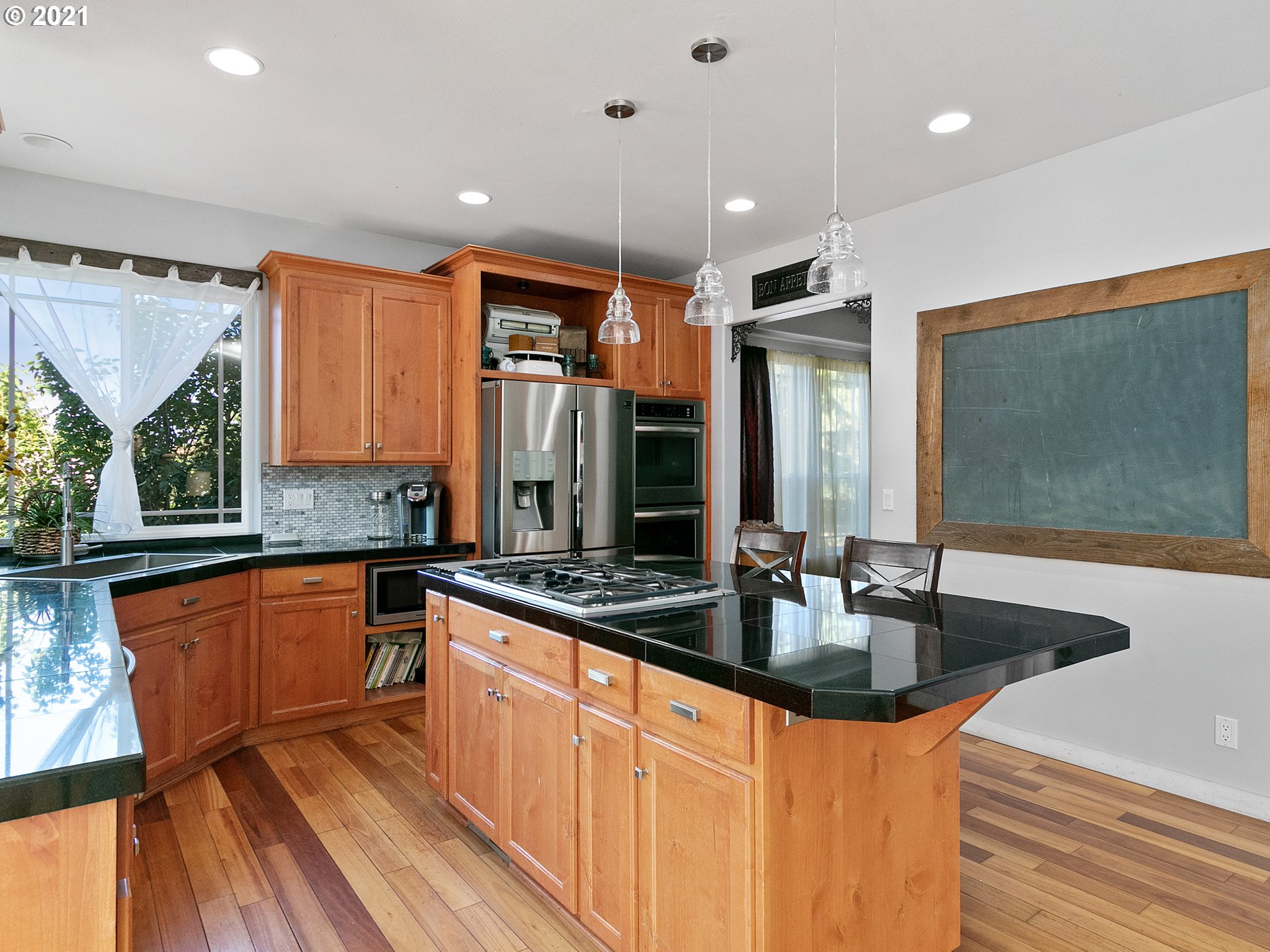 35412 Southeast Shade Tree Lane Estacada, OR 97023 - Photo 8 of 32 a kitchen with stainless steel appliances granite countertop a sink and a refrigerator