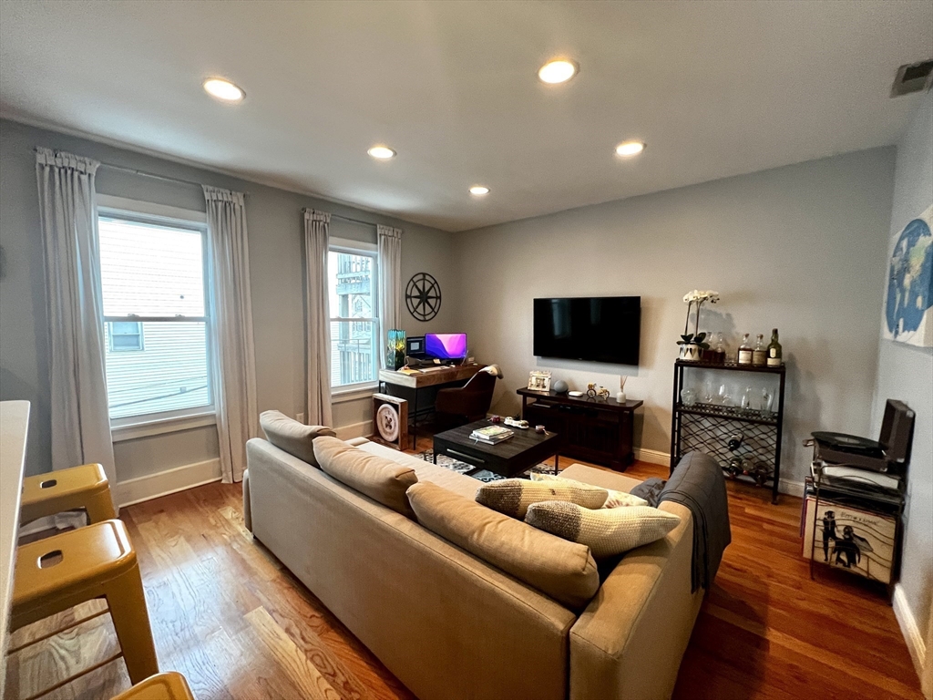 170 I Street, Unit 2 Boston, MA 02127 - Photo 3 of 10 a living room with furniture and a flat screen tv