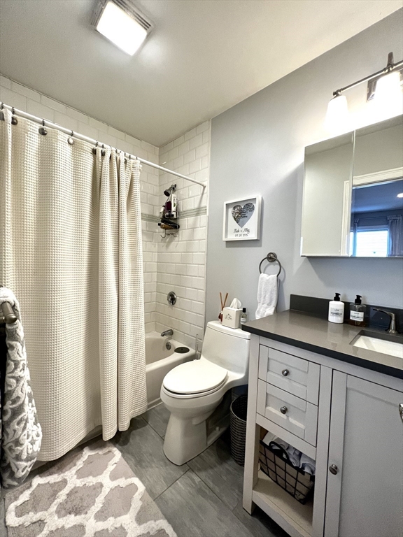 170 I Street, Unit 2 Boston, MA 02127 - Photo 4 of 10 a bathroom with a sink toilet and shower