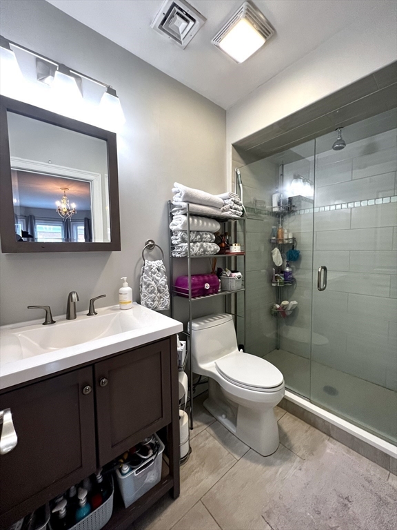 170 I Street, Unit 2 Boston, MA 02127 - Photo 8 of 10 a bathroom with a sink toilet and a mirror