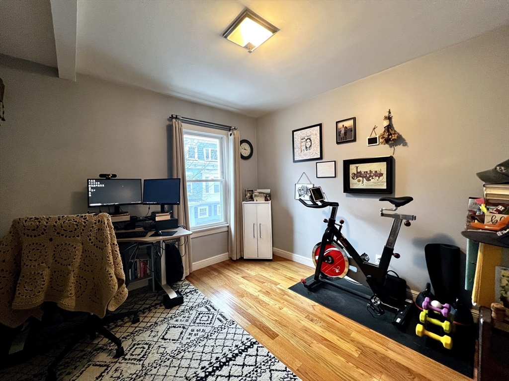 170 I Street, Unit 2 Boston, MA 02127 - Photo 9 of 10 a room with gym equipment and a flat screen tv