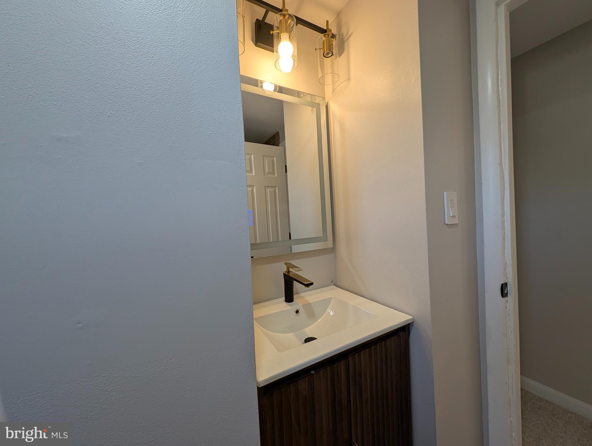 23 West Monroe Street Mount Holly, NJ 08060 - Photo 16 of 20 Sleek modern bathroom with stylish fixtures.