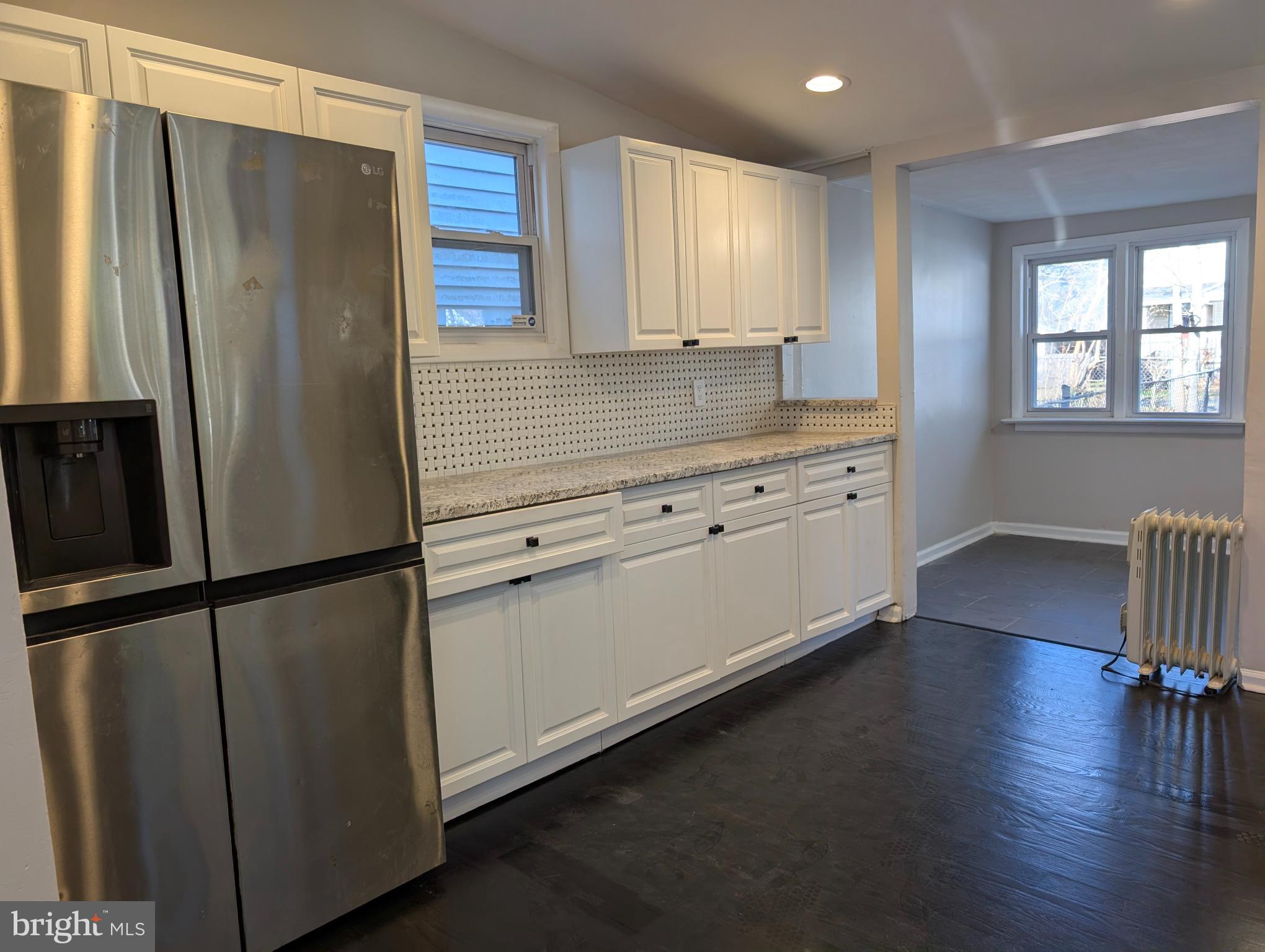 23 West Monroe Street Mount Holly, NJ 08060 - Photo 7 of 20 Modern kitchen with sleek finishes.