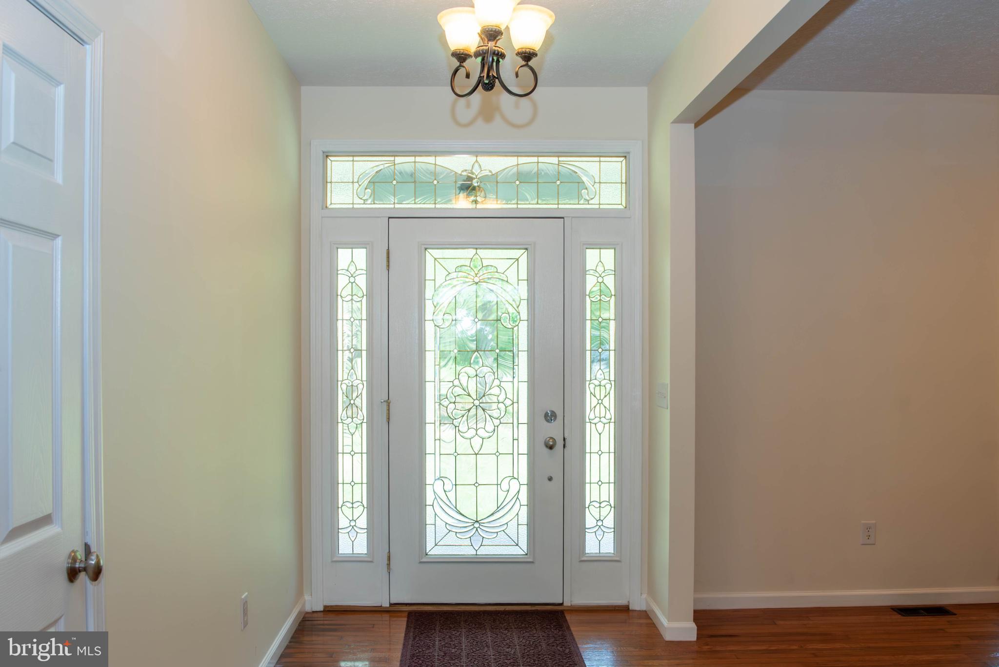 792 Forest Glen Road Moorefield, WV 26836 - Photo 22 of 146 Elegant entryway with stained glass.
