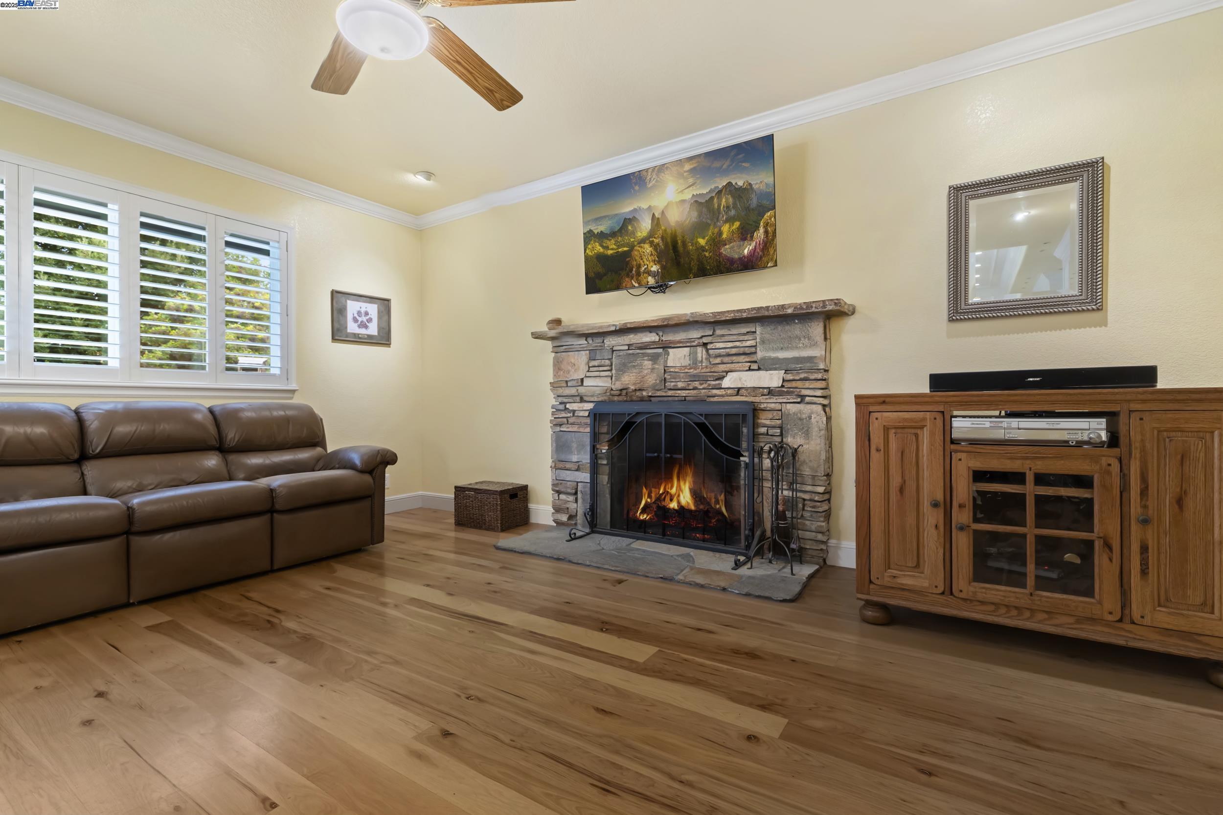 5145 Springdale Avenue Pleasanton, CA 94588 - Photo 11 of 51 a living room with furniture and a fireplace