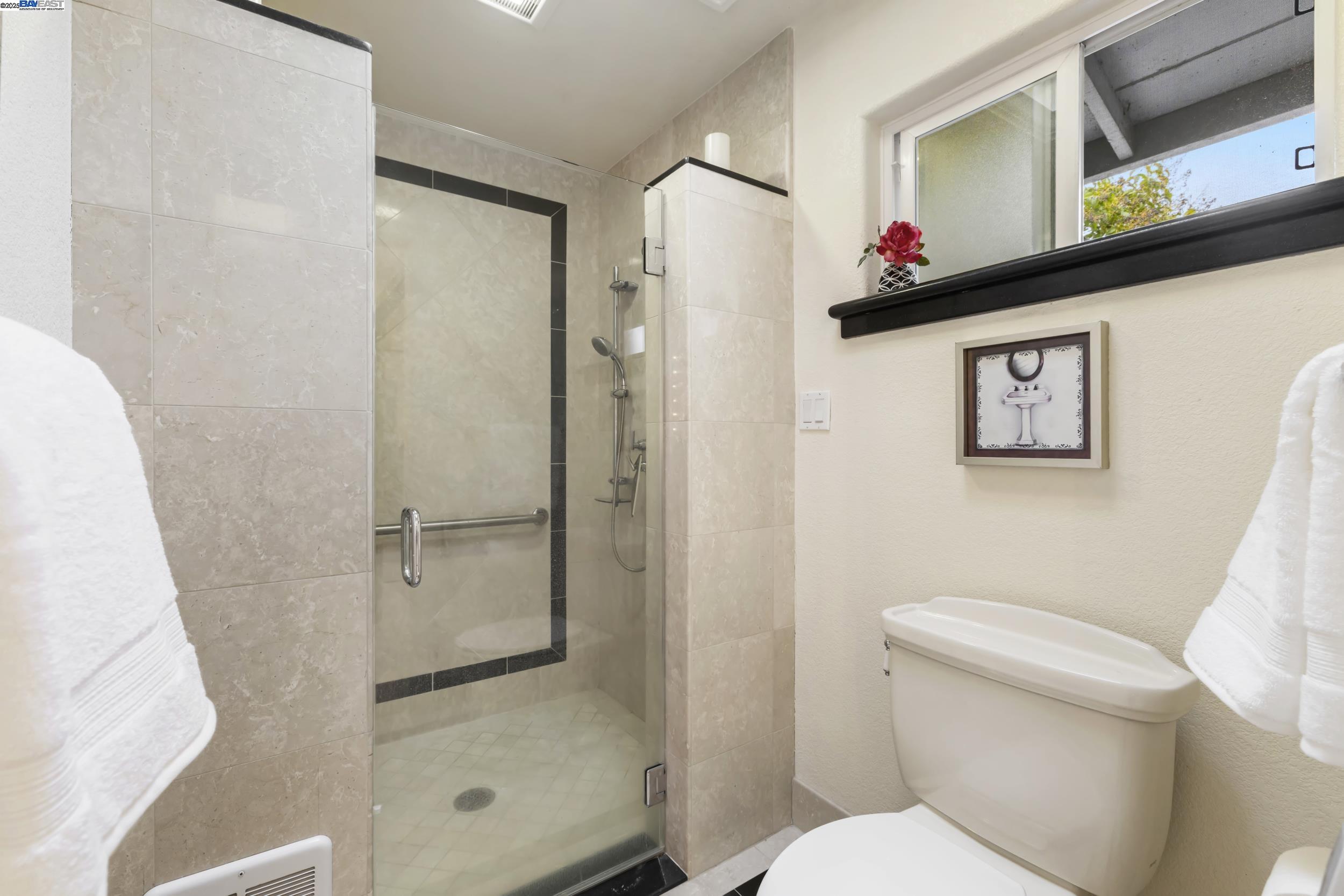 5145 Springdale Avenue Pleasanton, CA 94588 - Photo 27 of 51 a bathroom with a shower toilet and sink