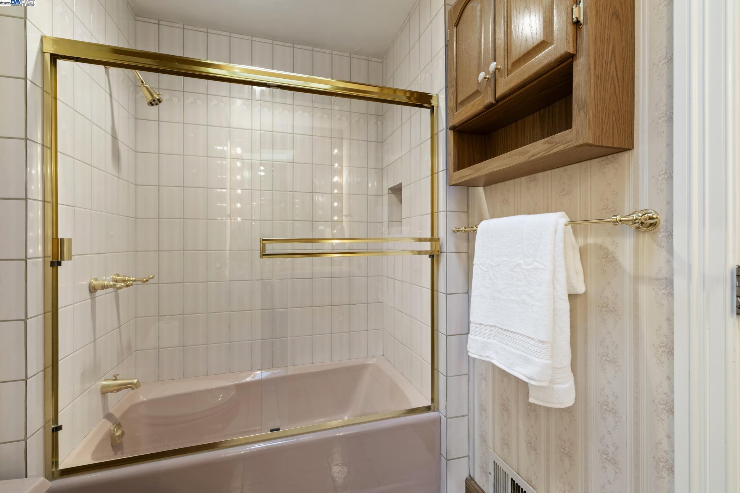 5145 Springdale Avenue Pleasanton, CA 94588 - Photo 29 of 51 a bathroom with a shower and a bath tub